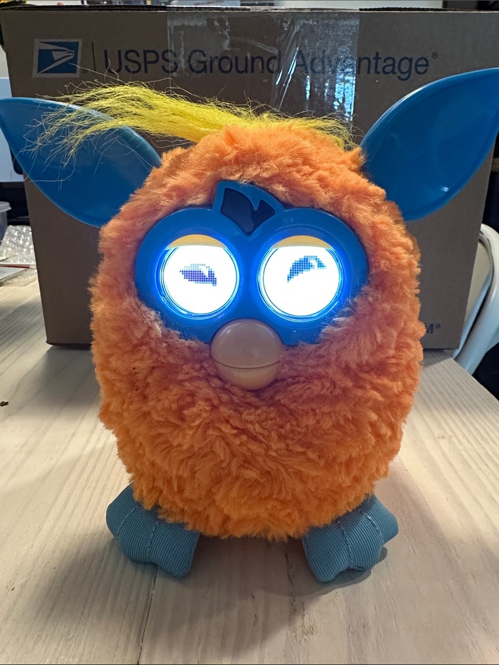 Interactive Orange Plush Toy with Blue Accents